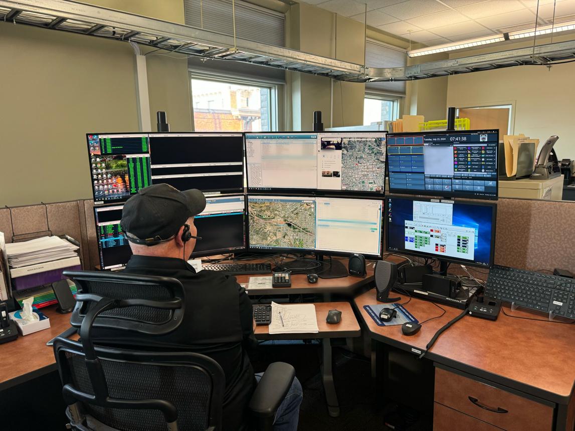 911 dispatcher working at an emergency communications center